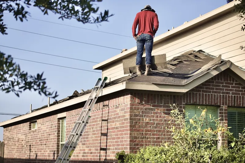 Professional roofer working on a residential roof in North Wantagh